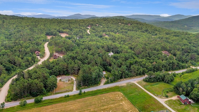 452 Flat Rd, Bethel, ME 04217 - bird's eye view of a heavily wooded area and a mountainous background