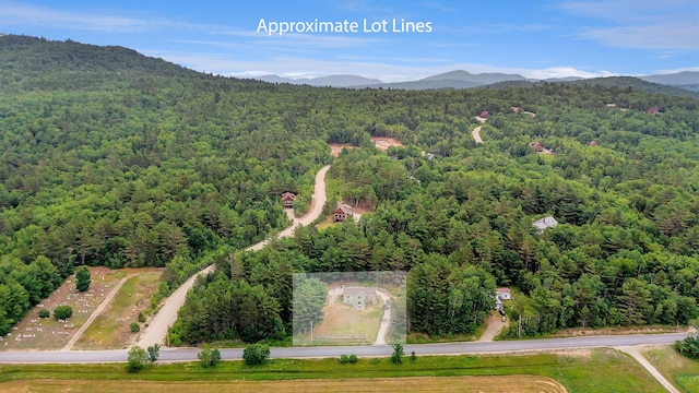 452 Flat Rd, Bethel, ME 04217 - aerial view of a heavily wooded area and a mountainous background