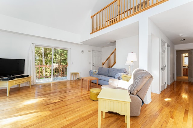 61 Dwelly Point Rd, Franklin, ME 04634 - living area with hardwood / wood-style floors, stairway, and a high ceiling