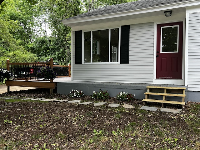 69 Heath St, Oakland, ME 04963 - view of side of home featuring entry steps, a wooden deck, and roof with shingles