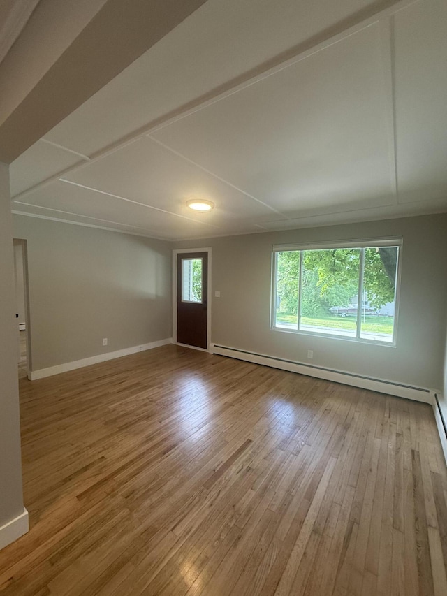69 Heath St, Oakland, ME 04963 - spare room with a baseboard heating unit and light wood-style floors