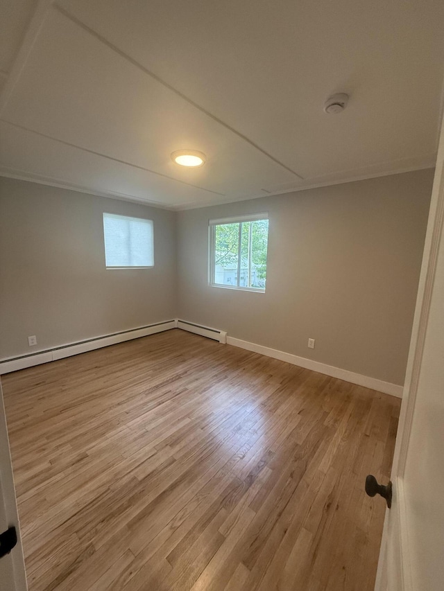 69 Heath St, Oakland, ME 04963 - spare room featuring wood finished floors, a smoke detector, and a baseboard radiator