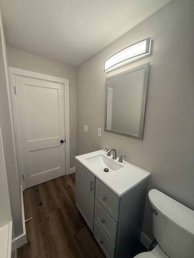 69 Heath St, Oakland, ME 04963 - half bath featuring vanity and wood finished floors