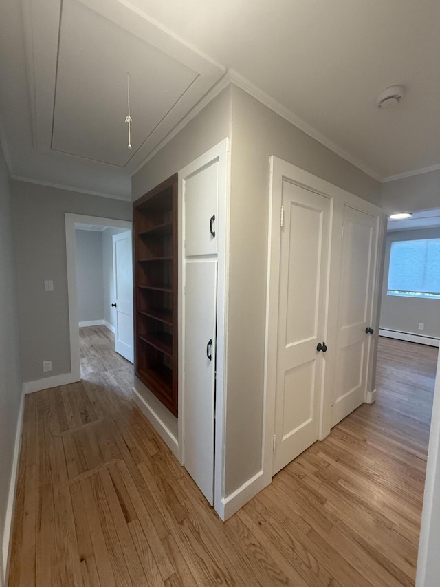 69 Heath St, Oakland, ME 04963 - corridor with attic access, light wood-type flooring, crown molding, and a baseboard heating unit