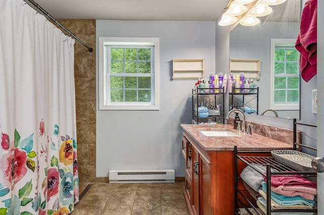 13 Dobson Rd, Berwick, ME 03901 - full bathroom with a baseboard heating unit, vanity, healthy amount of natural light, and a tile shower