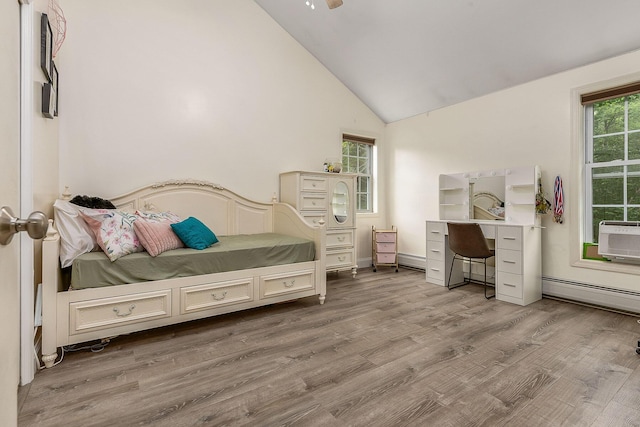 13 Dobson Rd, Berwick, ME 03901 - bedroom with a baseboard radiator, wood finished floors, high vaulted ceiling, cooling unit, and an office area