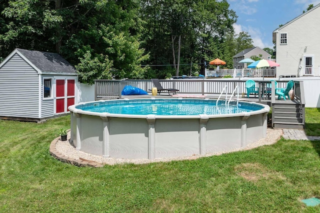 13 Dobson Rd, Berwick, ME 03901 - view of swimming pool featuring a deck, a storage shed, and a yard