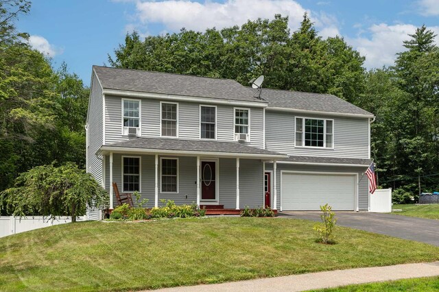 13 Dobson Rd, Berwick, ME 03901 - view of front of home with asphalt driveway, a garage, and covered porch