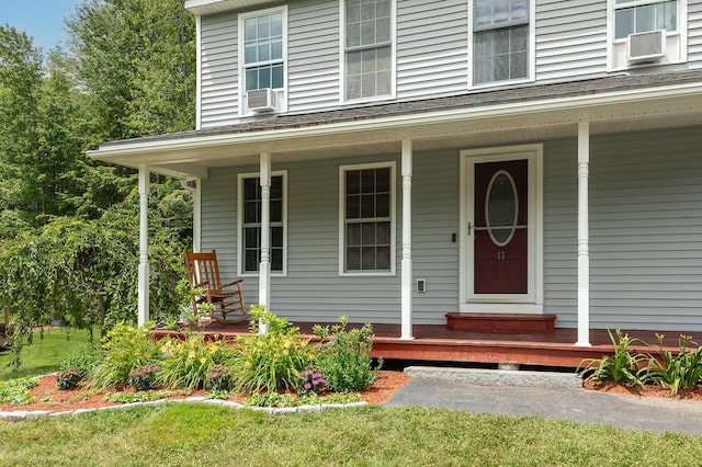 13 Dobson Rd, Berwick, ME 03901 - view of exterior entry featuring cooling unit, covered porch, and a yard