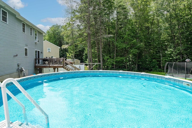 13 Dobson Rd, Berwick, ME 03901 - swimming pool with a deck, a trampoline, stairway, and a storage unit