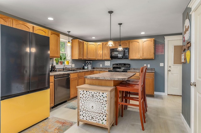 13 Dobson Rd, Berwick, ME 03901 - kitchen featuring black appliances, light wood-type flooring, recessed lighting, a kitchen island, and hanging light fixtures