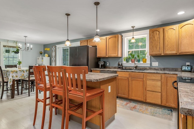 13 Dobson Rd, Berwick, ME 03901 - kitchen with stainless steel appliances, a center island, hanging light fixtures, a chandelier, and recessed lighting