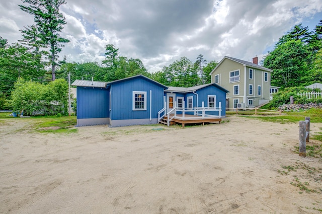 61 Shore Rd, Sebago, ME 04029 - back of house featuring a deck and view of wooded area