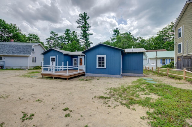 61 Shore Rd, Sebago, ME 04029 - back of house with a wooden deck