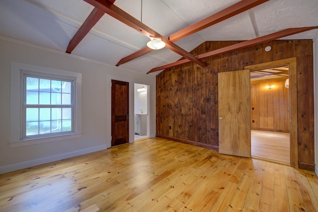 61 Shore Rd, Sebago, ME 04029 - unfurnished living room with wood walls and wood-type flooring