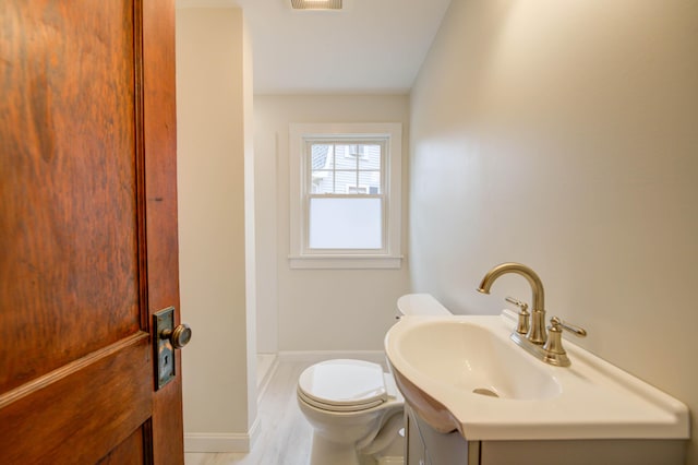 61 Shore Rd, Sebago, ME 04029 - bathroom featuring vanity and wood finished floors