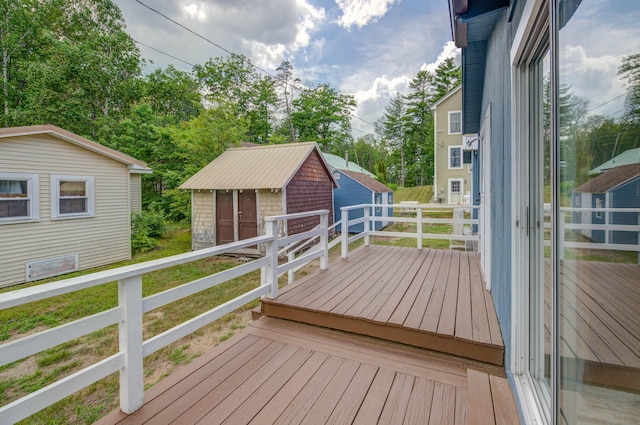 61 Shore Rd, Sebago, ME 04029 - wooden terrace featuring a storage shed