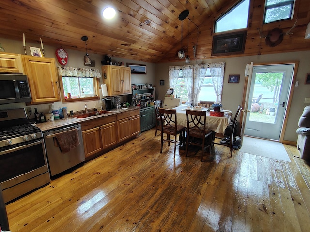 114 E Shore Rd, Benedicta Twp, ME 04733 - kitchen featuring stainless steel appliances, light wood-style flooring, healthy amount of natural light, pendant lighting, and wooden ceiling