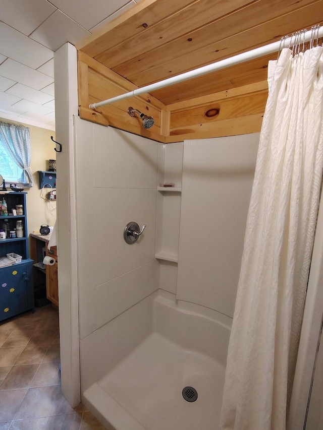 114 E Shore Rd, Benedicta Twp, ME 04733 - full bath with a shower with shower curtain and tile patterned floors