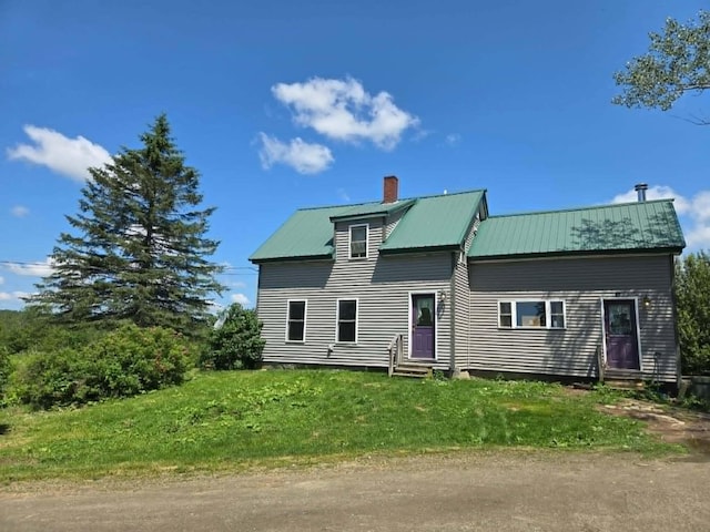 471 Chandler Hill Rd, Ripley, ME 04930 - rear view of house with entry steps, a chimney, and a metal roof