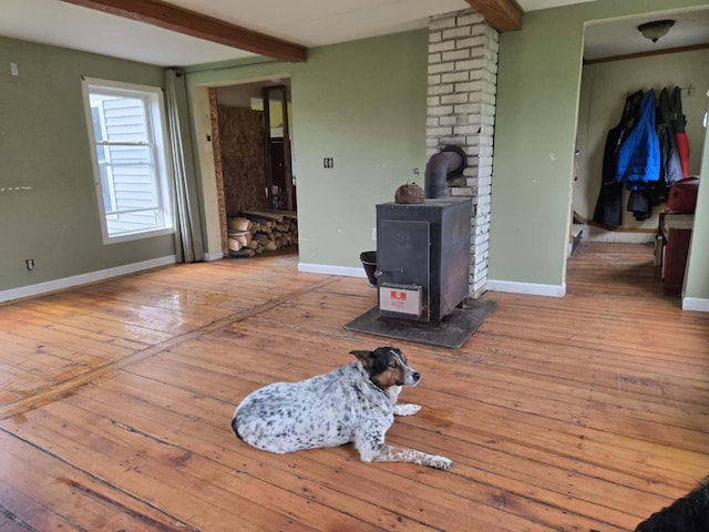 471 Chandler Hill Rd, Ripley, ME 04930 - living area with a wood stove, beamed ceiling, and wood-type flooring