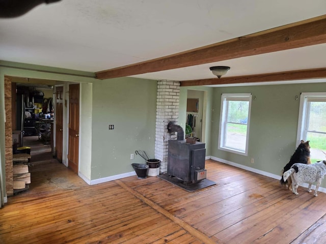 471 Chandler Hill Rd, Ripley, ME 04930 - living area with a wood stove, wood-type flooring, and beam ceiling