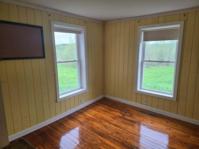 471 Chandler Hill Rd, Ripley, ME 04930 - unfurnished room featuring hardwood / wood-style flooring, plenty of natural light, and wooden walls