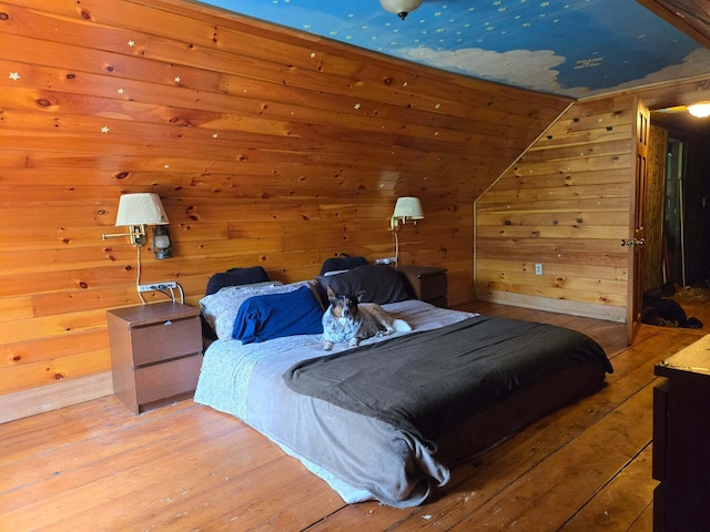 471 Chandler Hill Rd, Ripley, ME 04930 - bedroom with light wood finished floors, wood walls, and lofted ceiling