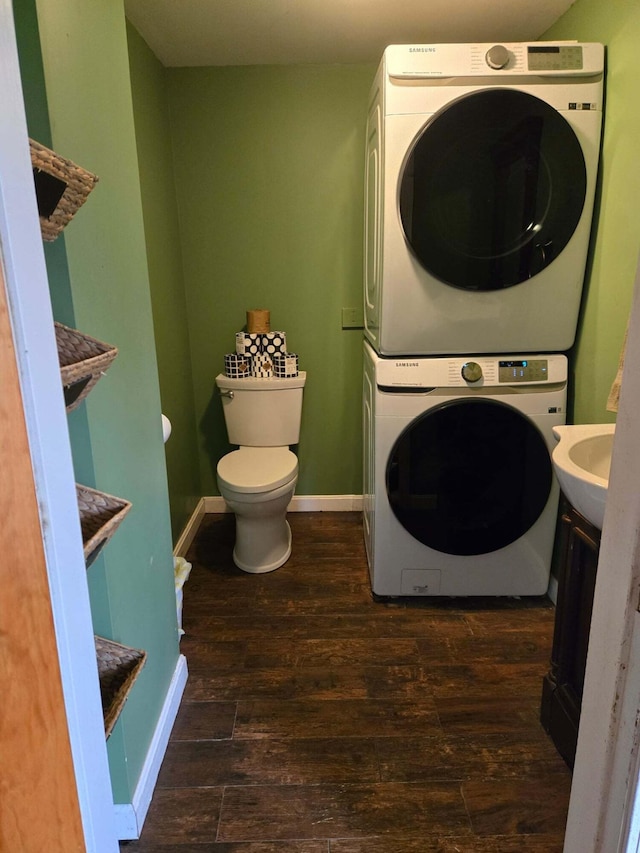 471 Chandler Hill Rd, Ripley, ME 04930 - laundry room featuring stacked washer / drying machine and wood finished floors
