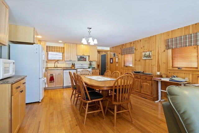 48 Green Bay Rd, Newfield, ME 04095 - dining space with a chandelier, light wood finished floors, and wooden walls