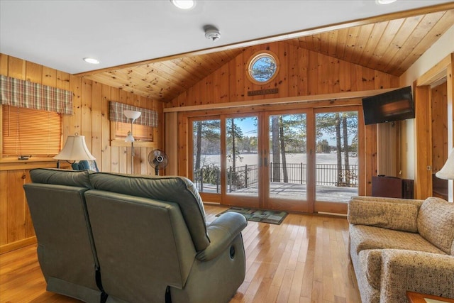 48 Green Bay Rd, Newfield, ME 04095 - living area featuring vaulted ceiling, wood walls, light wood-style floors, and recessed lighting