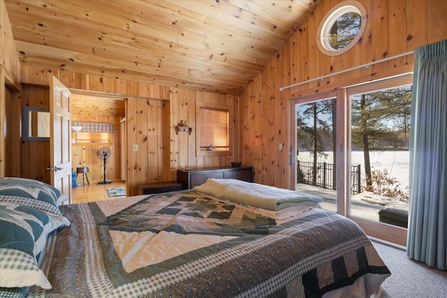 48 Green Bay Rd, Newfield, ME 04095 - bedroom with lofted ceiling, wooden walls, access to exterior, multiple windows, and a water view