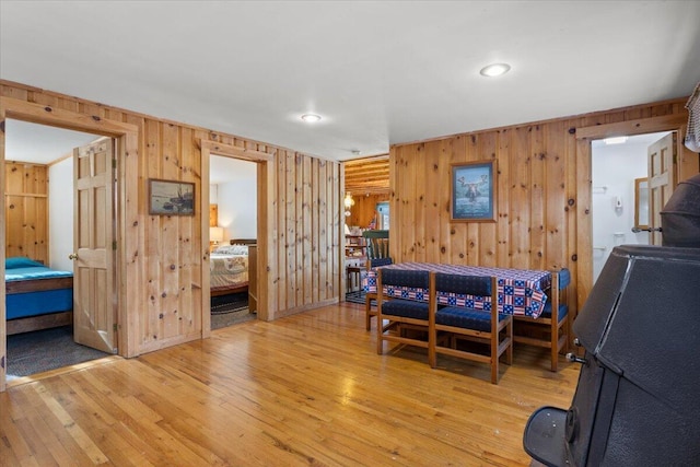 48 Green Bay Rd, Newfield, ME 04095 - bedroom featuring wooden walls, light wood-style flooring, and recessed lighting