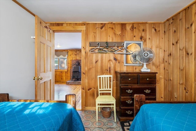 48 Green Bay Rd, Newfield, ME 04095 - bedroom featuring a wood stove and wooden walls