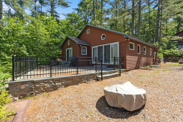 48 Green Bay Rd, Newfield, ME 04095 - view of front of home with faux log siding and a patio