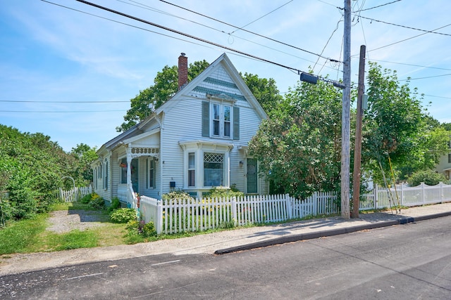 5 Purchase St, Rockland, ME 04841 - victorian home with a chimney and a fenced front yard