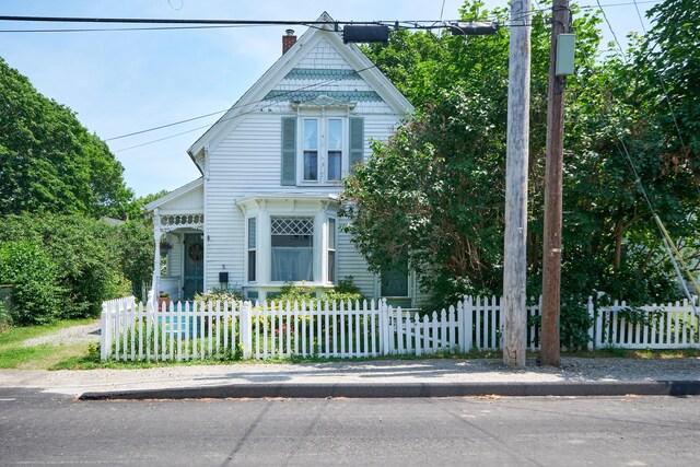 5 Purchase St, Rockland, ME 04841 - victorian-style house featuring a chimney and a fenced front yard