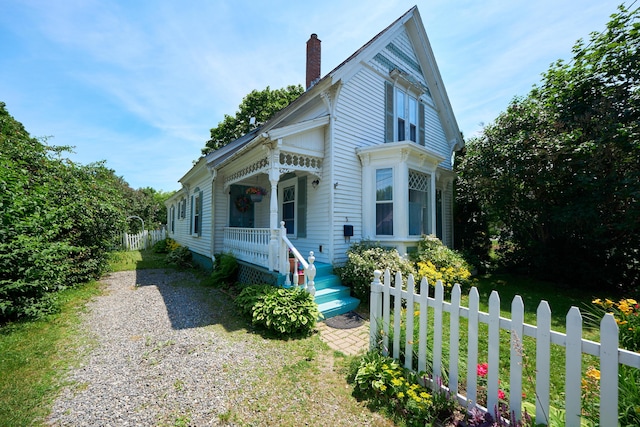 5 Purchase St, Rockland, ME 04841 - view of front of home featuring a chimney and covered porch