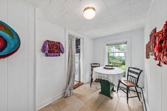 5 Purchase St, Rockland, ME 04841 - dining room featuring washer / dryer, light tile patterned floors, and a baseboard radiator
