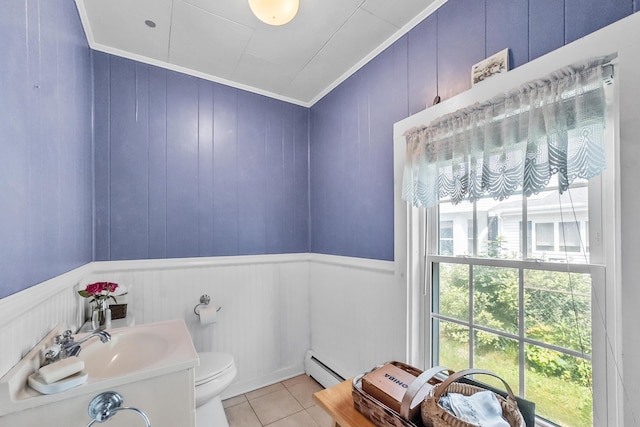 5 Purchase St, Rockland, ME 04841 - half bath featuring a baseboard radiator, tile patterned floors, crown molding, vanity, and wainscoting