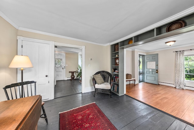 5 Purchase St, Rockland, ME 04841 - sitting room with dark wood finished floors, ornamental molding, and baseboard heating