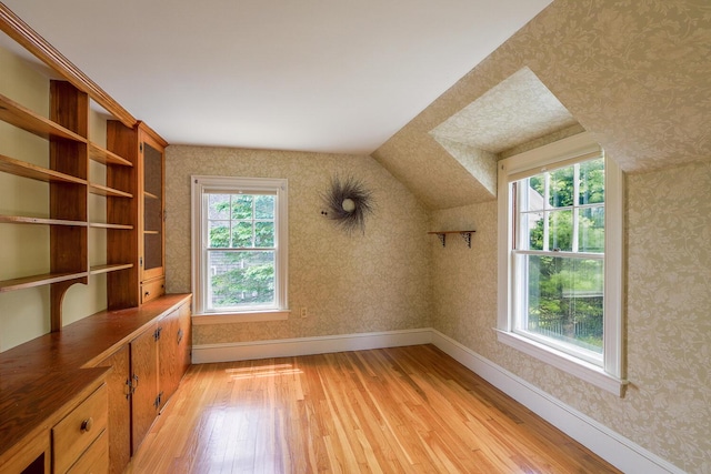 69 W Meadow Rd, Rockland, ME 04841 - bonus room with light wood-style floors, vaulted ceiling, and wallpapered walls