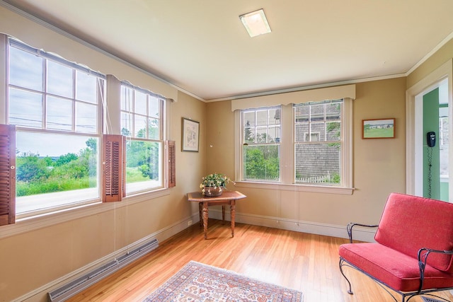 69 W Meadow Rd, Rockland, ME 04841 - sitting room with crown molding, light wood-style floors, and healthy amount of natural light