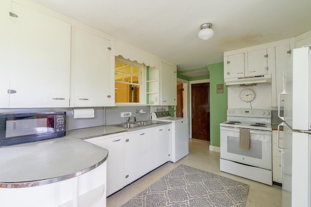 69 W Meadow Rd, Rockland, ME 04841 - kitchen featuring white appliances, washer / dryer, under cabinet range hood, white cabinetry, and light countertops