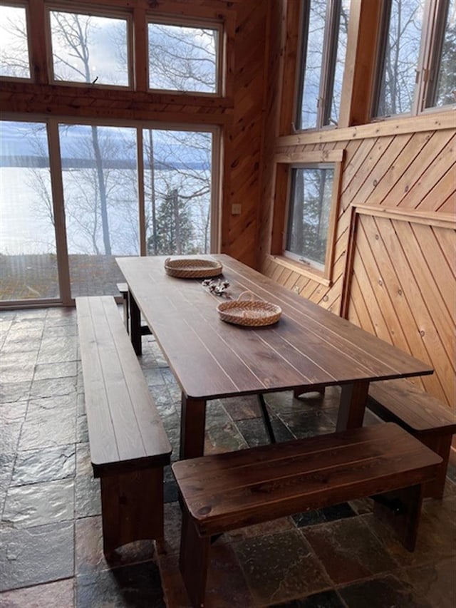 24 Cliffside Dr, Saint Albans, ME 04971 - dining space with wooden walls and a high ceiling