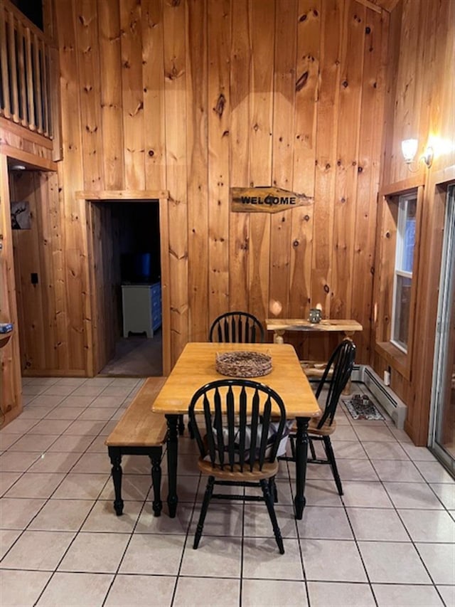 24 Cliffside Dr, Saint Albans, ME 04971 - dining room featuring light tile patterned floors, a baseboard radiator, and wooden walls