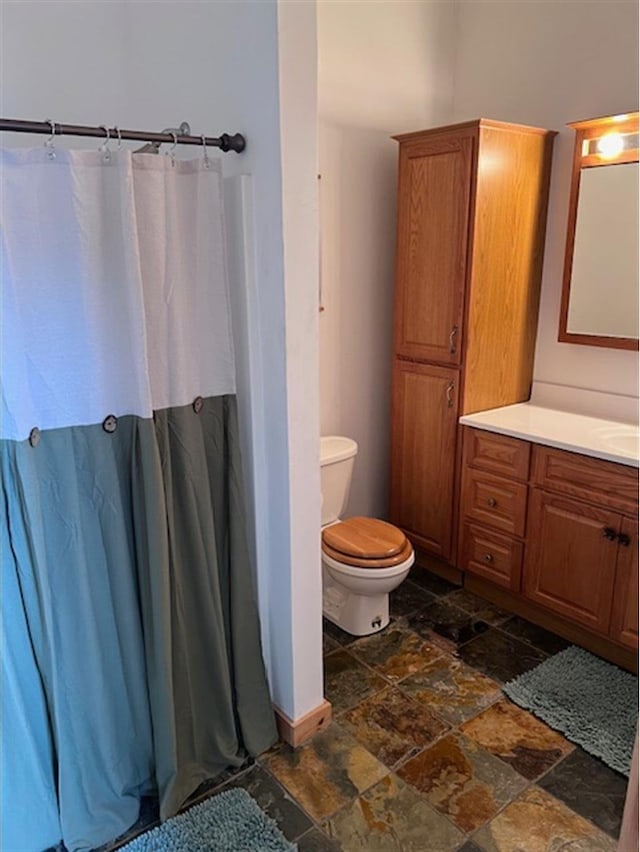 24 Cliffside Dr, Saint Albans, ME 04971 - full bathroom featuring stone tile flooring, vanity, and a shower with curtain