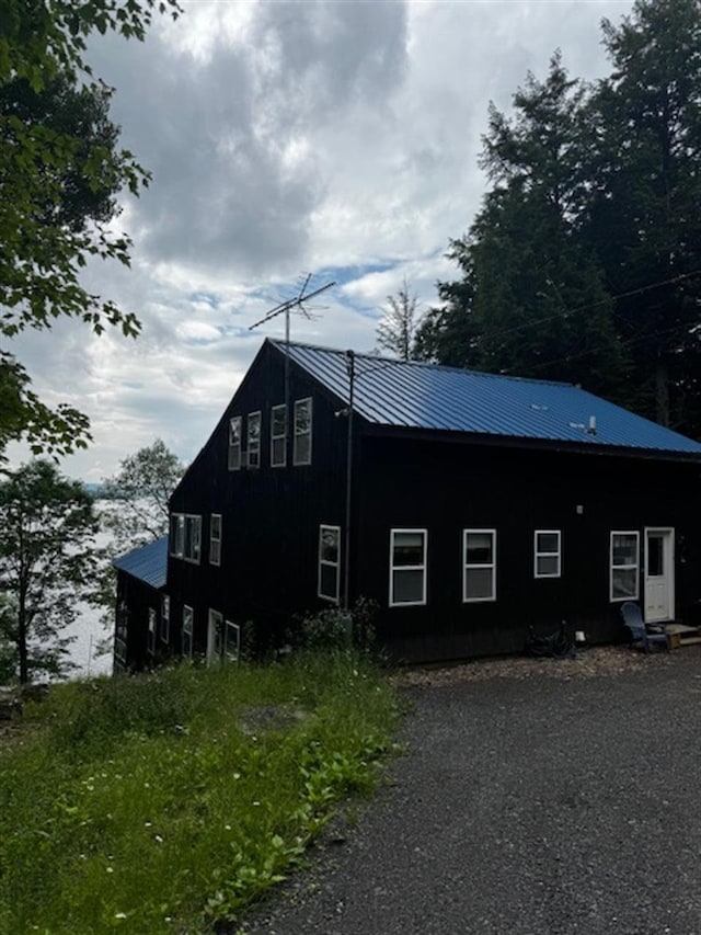24 Cliffside Dr, Saint Albans, ME 04971 - view of side of home featuring a metal roof