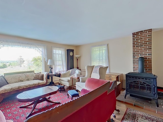 63 N Shore Dr, Owls Head, ME 04854 - living area with wood finished floors and a wood stove