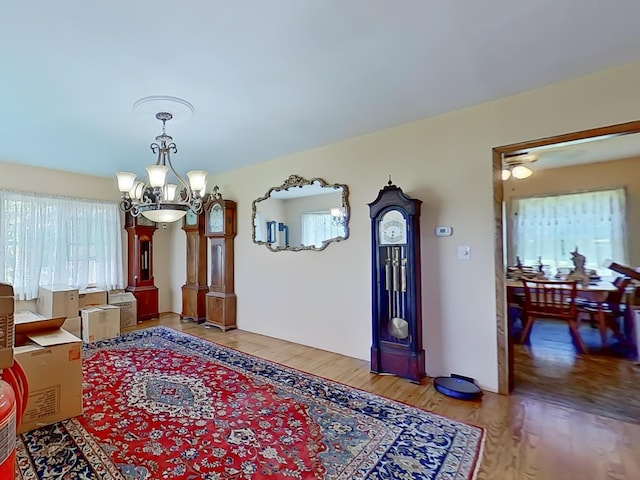 63 N Shore Dr, Owls Head, ME 04854 - foyer with a chandelier and light wood finished floors